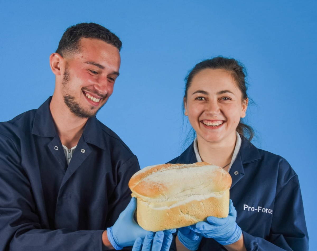 Pro-Force Employees Holding Bread